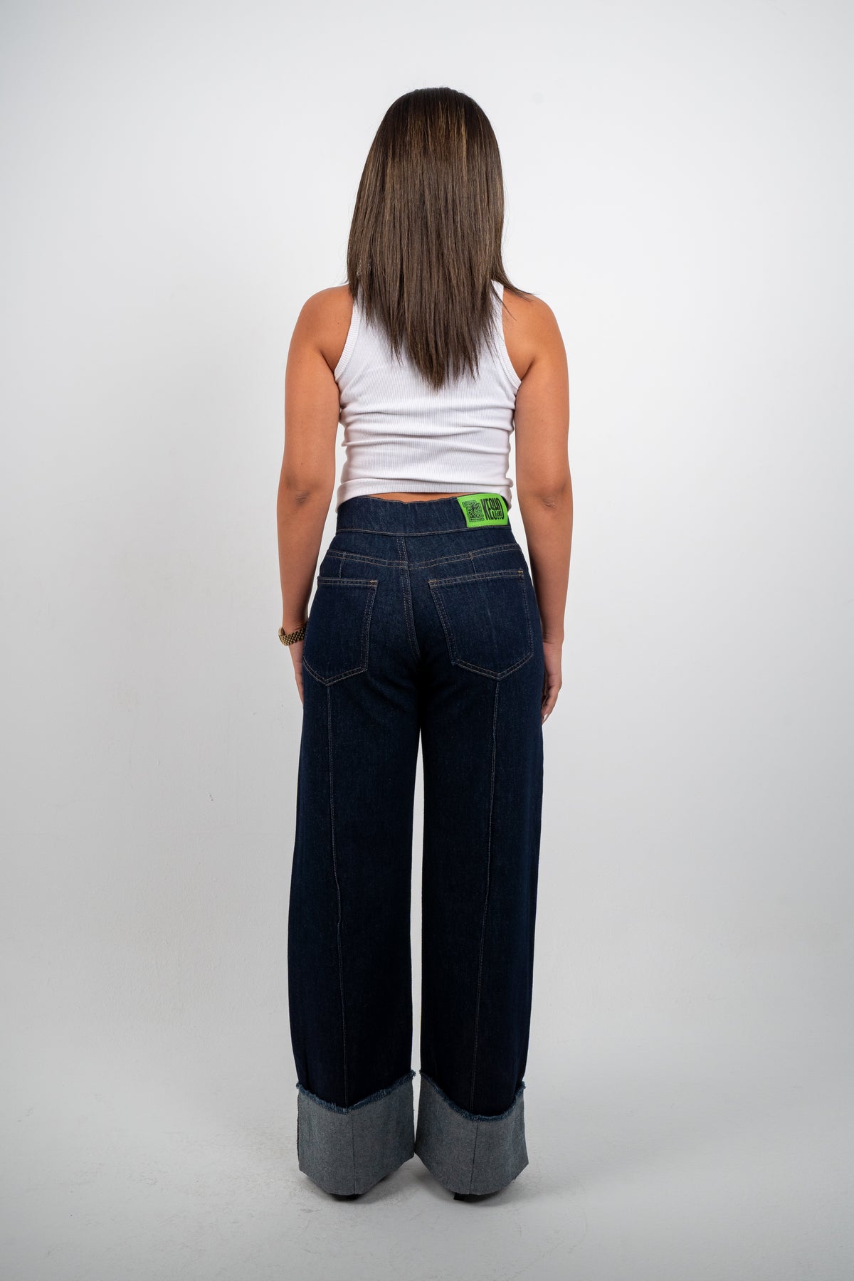 Double Button Cuffed Jeans — Dark, back view