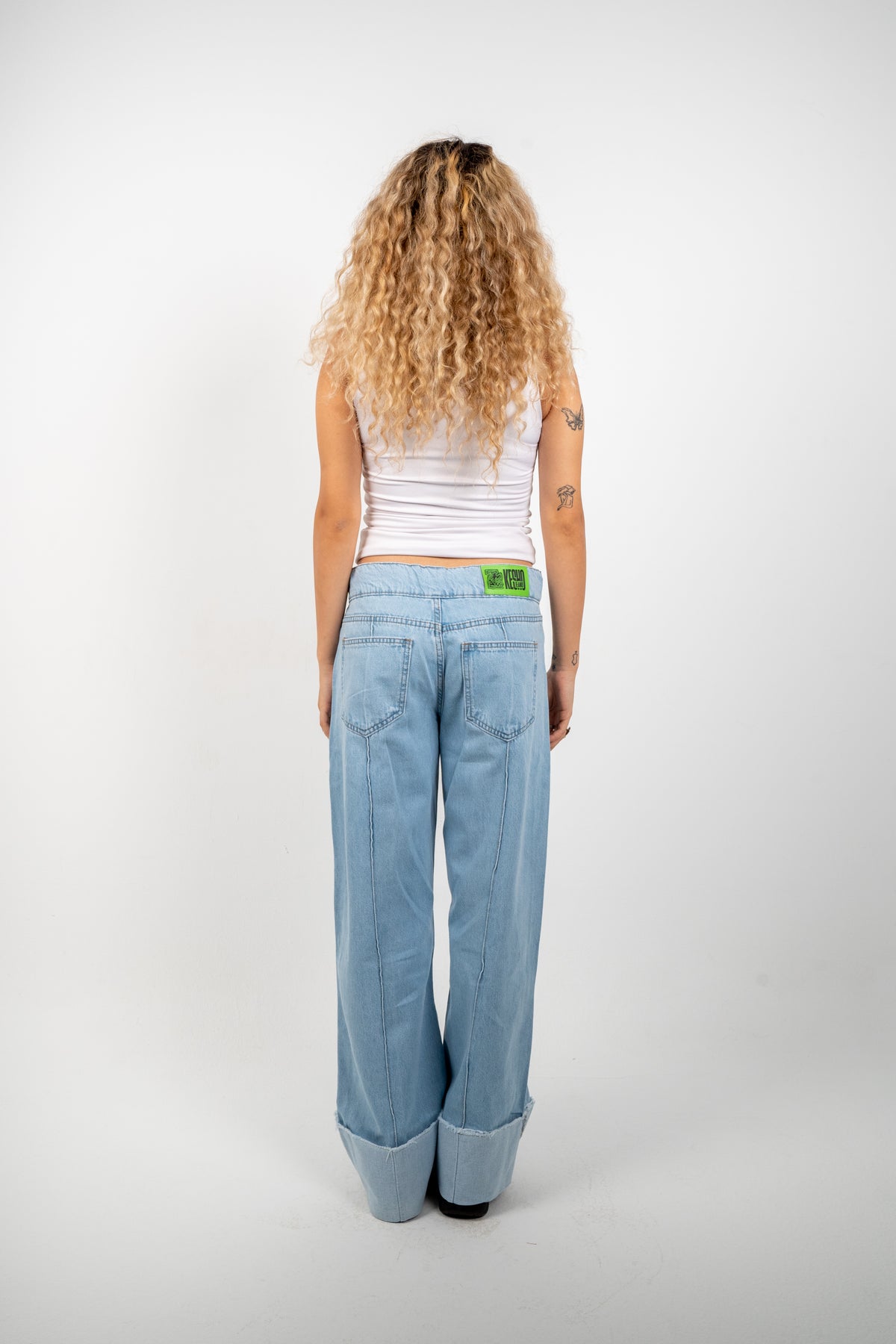 Double Button Cuffed Jeans — Light, back view