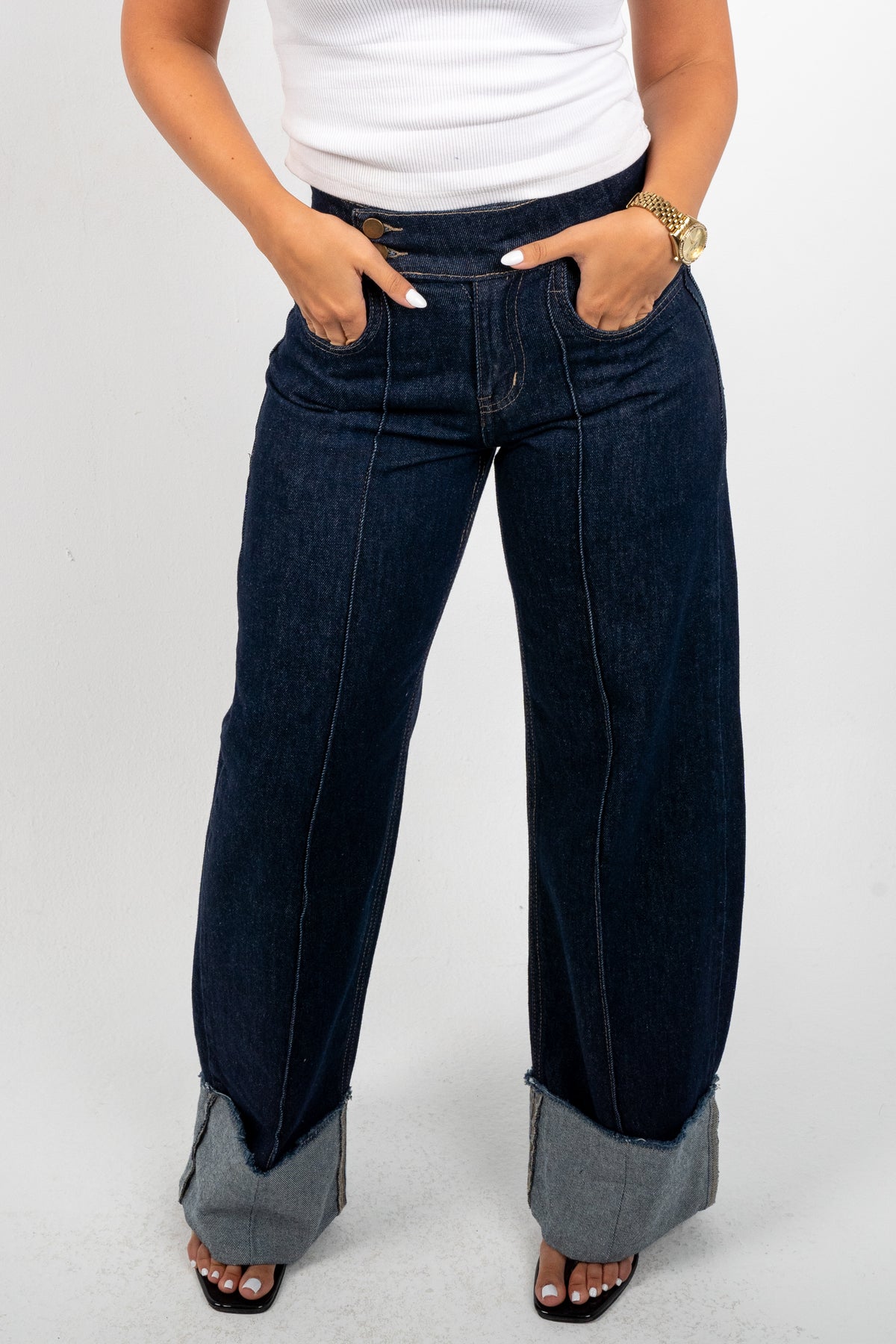 Double Button Cuffed Jeans — Dark, close-up of the rolled cuffs